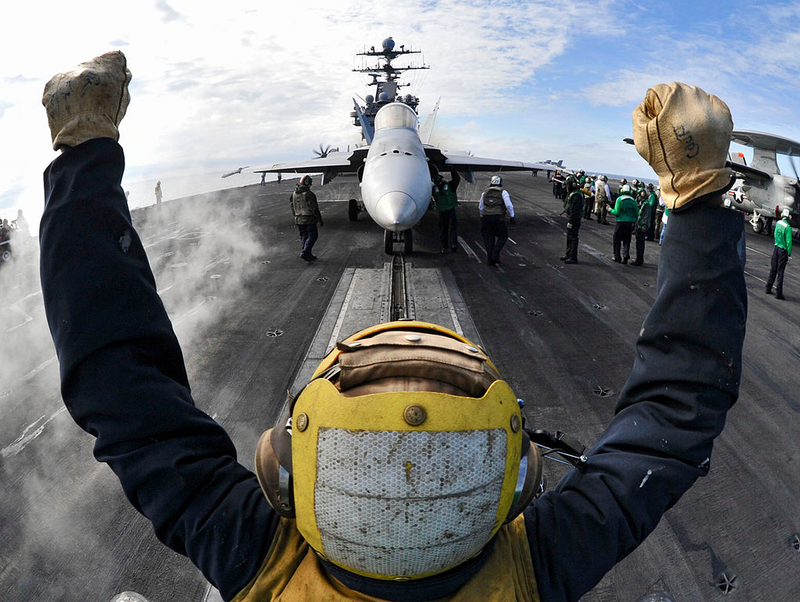 Illustration for article titled Here Is What All Those Colored Shirts Mean On An Aircraft Carrier's Deck